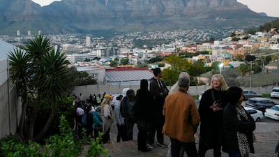 People queue to cast their votes at a polling station during general elections, in Cape Town, South Africa. AP