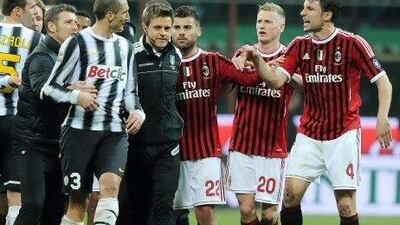 AC Milan's midfielder Mark Van Bommel, right, argues with Juventus defender Giorgio Chiellini, left, during the Serie A match.