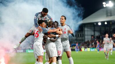 Liverpool winger Sadio Mane, centre, celebrates with teammates after scoring his team's second goal. Reuters