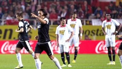 Malaga defender Martin Demichelis celebrates his goal against Sevilla.