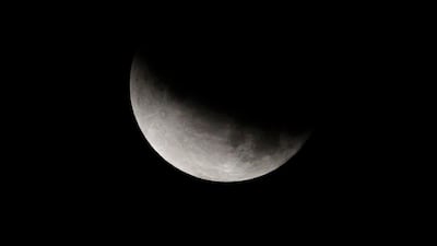 The earth's umbra partially shadowed the moon during a partial lunar eclipse in Kolkata, India. AP Photo/Bikas Das