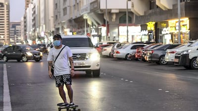 A skateboarder makes use of the road before Al Yahar Street gets busy after sunset.