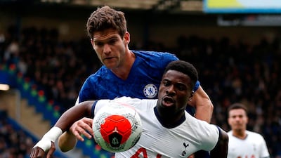 Tottenham Hotspu defender Serge Aurier vies with Chelsea defender Marcos Alonso (back). AFP