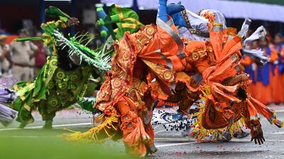 Folk dancers perform a traditional Chhou dance duringcelebrations to mark India's 75th Independence Day, at the Red Road in Kolkata, capital of the eastern state of West Bengal. AFP