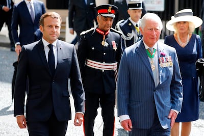 French President Emmanuel Macron (L), The Lord-Lieutenant of Greater London, Sir Kenneth Olisa (2nd L), Britain's Prince Charles, Prince of Wales (2nd R) and Britain's Camilla, Duchess of Cornwall (R) arrive to lay wreaths at the statue of former French president Charles de Gaulle at Carlton Gardens in central London on June 18, 2020. AFP