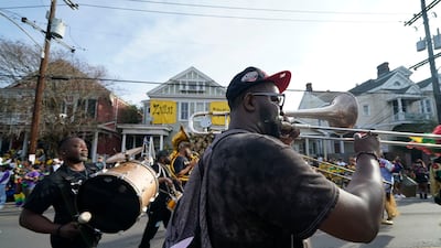 A brass band marches during the traditional Krewe of Zulu Parade. AP