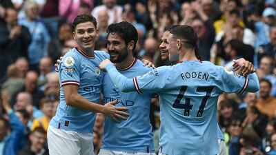Manchester City's Ilkay Gundogan, second from left, celebrates with teammates after scoring his side's second goal. AP