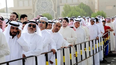Kuwaitis line up to vote in their July parliamentary elections. Kuwait’s welfare system provides citizens with grants and loans for education, health, housing, and subsidies on electricity and fuel. Raed Qutena / EPA