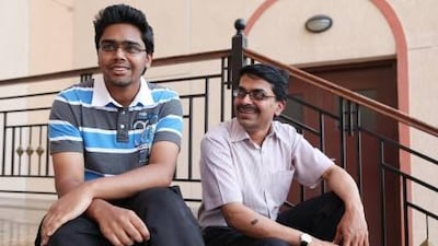 Akhilesh Mohan shares a moment with his father, Mohan Sankaran, after scoring the highest marks in the UAE for the India curriculum examinations.