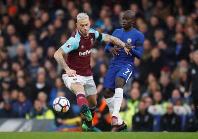 West Ham United's Marko Arnautovic, left, in action with Chelsea's N'Golo Kante. Eddie Keogh / Reuters