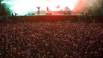 Festival-goers watch Wolf Alice perform at Latitude Festival at Henham Park.
