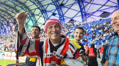Mahdi Al Karkhi gets the crowd excited before Iraq faces off against Iran in Dubaiduring the Asian Cup on Wednesday. Leslie Pableo for The National