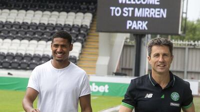 Saidy Janko, left, alongside Celtic assistant manager John Collins after signing for the Scottish champions. Jeff Holmes / Getty / July 1, 2015