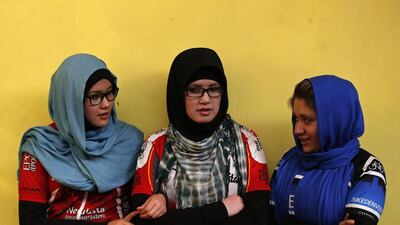 Masooma Alizada, left, Zahra Alizada, centre, and Frozan Rasooli, members of Afghanistan’s Women’s National Cycling Team talk with each other before training. Mohammad Ismail / Reuters