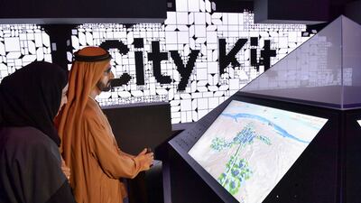 Sheikh Mohammed bin Rashid tries out some of the museum's technological features. Wam