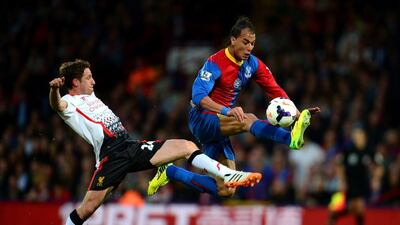 Marouane Chamakh leaps for the ball while with Crystal Palace against Liverpool in a 2014 Premier League match. Jamie McDonald / Getty Images / May 5, 2014