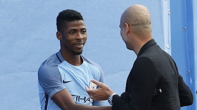 Manchester City manager Pep Guardiola with Kelechi Iheanacho at the City Football Academy. Craigh Brough / Action Images / Reuters