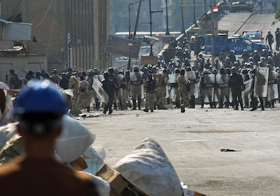 Iraqi security forces confront protesters at the Shuhada bridge, one of several leading to Baghdad's Green Zone where government buildings are located. AFP