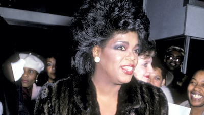 Oprah Winfrey wears a black fur coat to attend the premiere of 'Native Son' at the Apollo Theatre, New York City on December 8, 1986. Getty Images