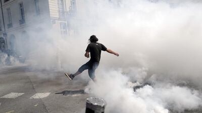 A demonstrator kicks back a tear gas cannister during a rally in Nantes, called in memory of Steve Maia Canico. EPA