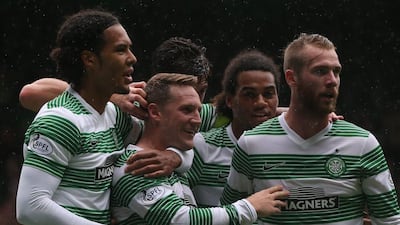 Kris Commons, centre, shown with Celtic teammates during their Scottish Premiership match against Dundee United on Saturday. Ian MacNicol / Getty Images / August 16, 2014