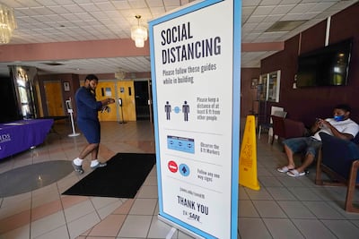Social distancing as well as face covering are recommended at a Covid-19 vaccination site at Jackson State University in Mississippi. Hundreds of colleges nationwide have told students they must be fully vaccinated before classes begin in a matter of weeks. AP