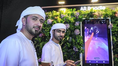 Visitors get their hands on the device.