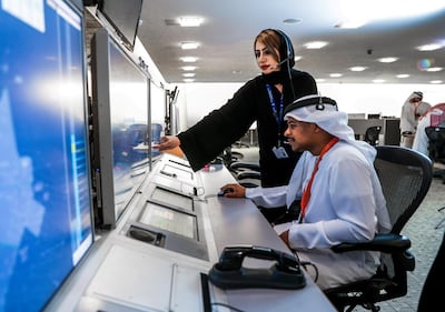 UAE nationals at work at the Sheikh Zayed Air Navigation Centre in Abu Dhabi. Victor Besa / The National