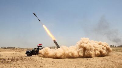 Pro-government forces fighters fire a rocket in Al Sejar village in Iraq’s Anbar province on May 27, 2016, as they take part in a major assault to retake the city of Fallujah from ISIL. Ahmad Al Rubaye /AFP
