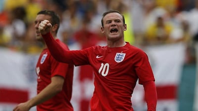 England's Wayne Rooney celebrates with teammate Rickie Lambert after scoring a goal against Ecuador on Wednesday. Wolfgang Rattay / Reuters / June 4, 2014