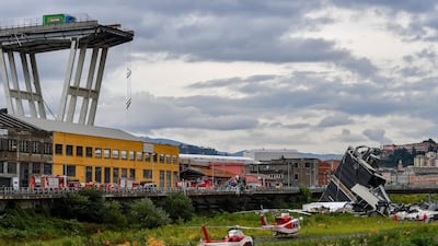 Rescue services attend the scene at the Morandi bridge which collapsed. Getty Images