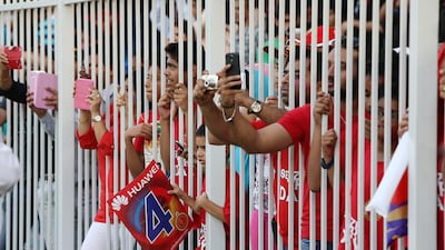 To understand how IPL fever has gripped the UAE just watch a crowd before the start of Imatch, such as the one between Royal Challengers Bangalore and Kolkata Knight Riders at Sharjah Cricket Stadium in Sharjah on April 24, 2014. Pawan Singh / The National