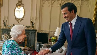 Britain's Queen Elizabeth II welcomes Qatari Emir Sheikh Tamim at Windsor Castle on Tuesday. AFP