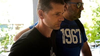 Alexander Vinnik (L) is arrested in Thessaloniki, Greece. Alexandros Avramidis / Reuters