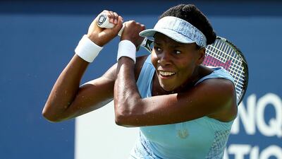 Venus Williams returns a shot to Serena Williams during the women’s semifinals match in the Rogers Cup at Uniprix Stadium on August 9, 2014 in Montreal, Canada. Streeter Lecka/Getty Images