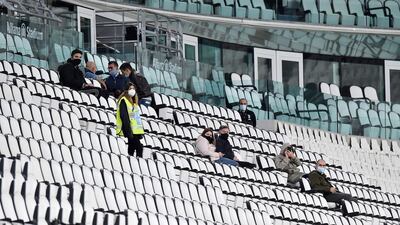 Supporters inside the Juventus Stadium wait to discover if the match against Napoli will go ahead. EPA