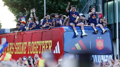 Spain's World Cup winners in an open-top bus during the victory parade in Madrid. AFP