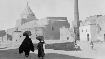 Ancient Mosul, a Yezidi shrine to the left and the Al Nouri Mosque to the right. Alamy