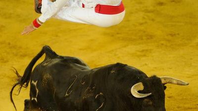 Guillaume Vergonzeanne of the French Recortadores company Passion Saltador leaps over a charging bull at the end of the Liga de Corte Puro finals on Sunday. Denis Doyle / Getty Images