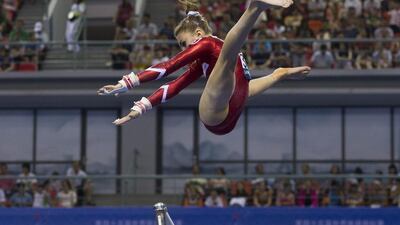 Switzerland’s Ilaria Kaeslin leaps from the uneven bars as she competes in the women’s qualifying round of the Artistic Gymnastics World Championships at the Guangxi Gymnasium in Nanning, capital of south-west China’s Guangxi Zhuang Autonomous Region. Andy Wong / AP