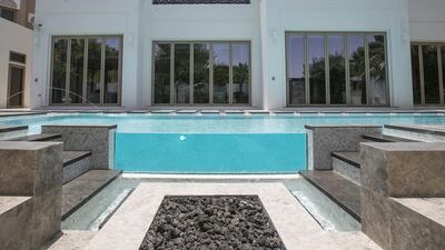 The pool deck also has a private Jacuzzi, while the villa has three balconies with views. Mona Al Marzooqi / The National