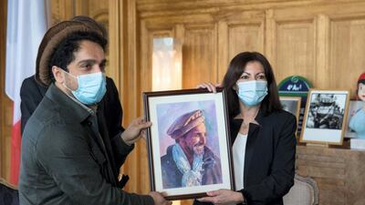 Ahmad Massou and Paris Mayor Anne Hidalgo hold up a portrait of late Afghan commander Ahmad Shah Massoud. Courtesy Office of Paris Mayor