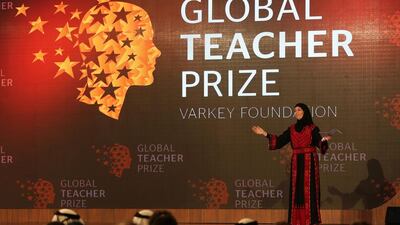 Palestinian primary school teacher Hanan Al Hroub speaks after she won the second annual Global Teacher Prize, in Dubai. Kamran Jebreili / AP Photo