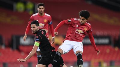 Mikel Merino of Real Sociedad is tackled by Shola Shoretire of Manchester United. Getty