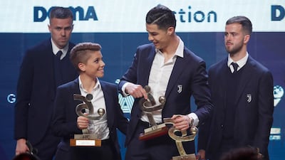 Cristiano Ronaldo, right, and Best Women's Player Manuela Giugliano on stage at the Gran Gala del Calcio 2019 ceremony. AP Photo