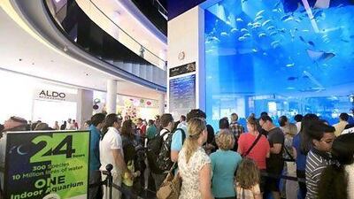 Standout feature: the aquarium, teeming with sealife, centre, proved popular viewing with patrons of Dubai Mall during its two 24-hour Eid holiday shopping days. Satish Kumar / The National