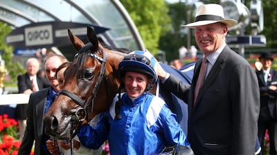 Jockey Paul Hanagan, centre, and trainer John Gosden, left, have been elated after Taghrooda won at the Ascot last month. Charlie Crowhurst / Getty Images
