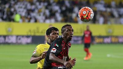Khalil, right, of Al Ahli battles Waheed of Al Wasl during their Arabian Gulf League match at Zabeel Stadium in Dubai. ( Pawan Singh / The National )