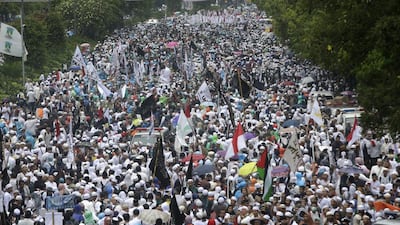 Indonesians march during a rally against Jakarta’s minority Christian governor Basuki Purnama, who is being prosecuted for blasphemy, near the National Monument in Jakarta on December 2, 2016. Tatan Syuflana / AP Photo