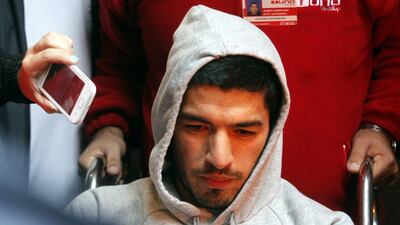 Luis Suarez is moved from Medica Uruguaya hospital after his operation, in Montevideo, Uruguay. Suarez underwent surgery to repair a meniscus in his left knee. Ivan Franco / EPA